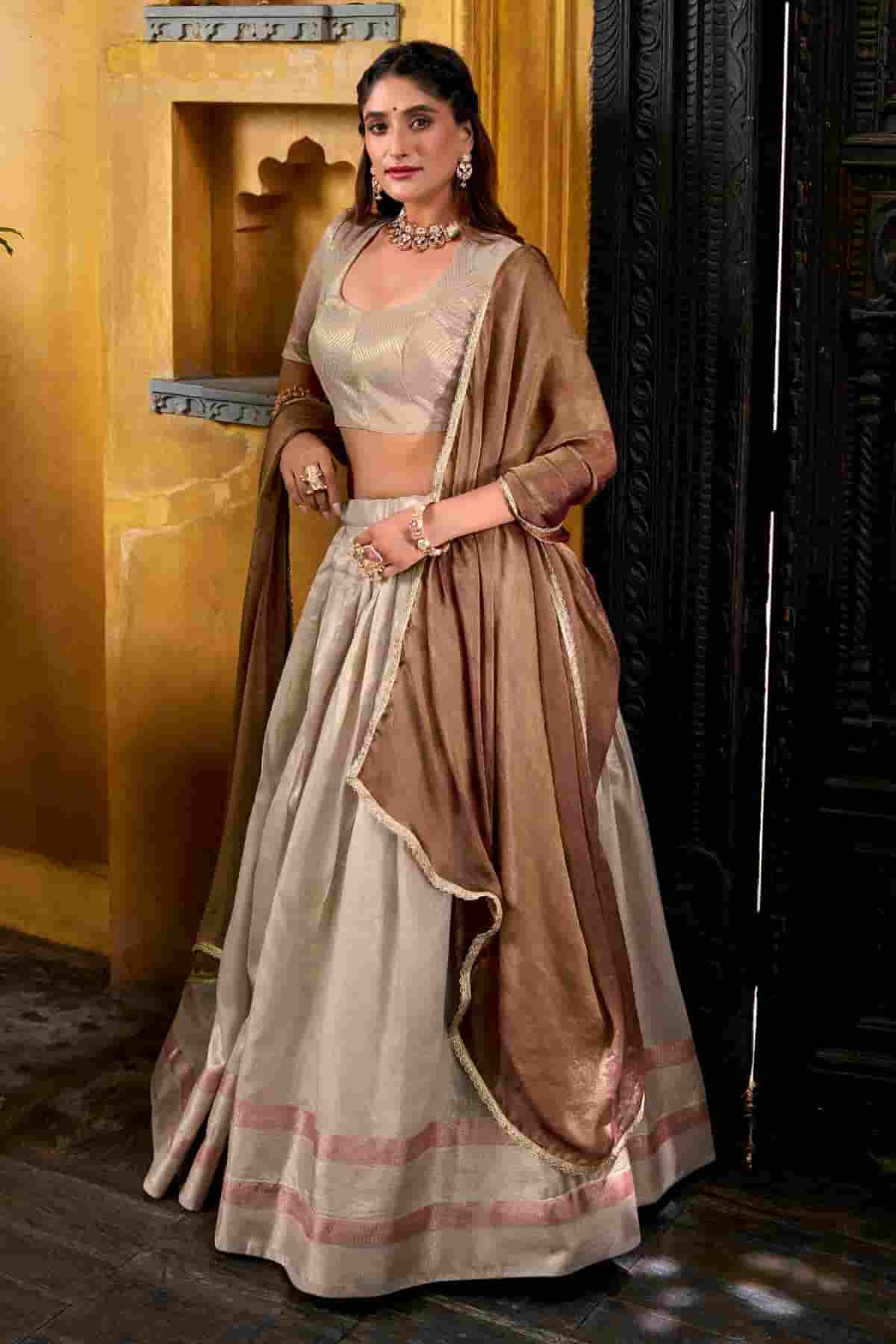 Dhupion Silk Stitched Lehenga Choli In Cream Colour