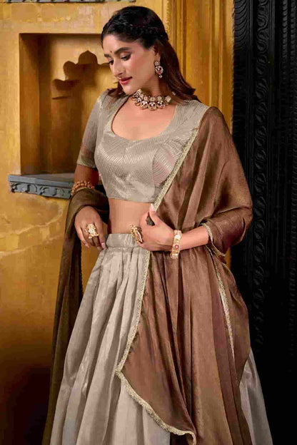 Dhupion Silk Stitched Lehenga Choli In Cream Colour