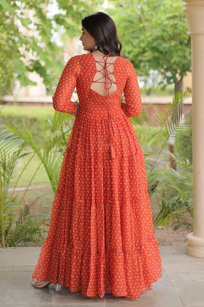 Faux Georgette Printed Stitched Gown In Rust Colour
