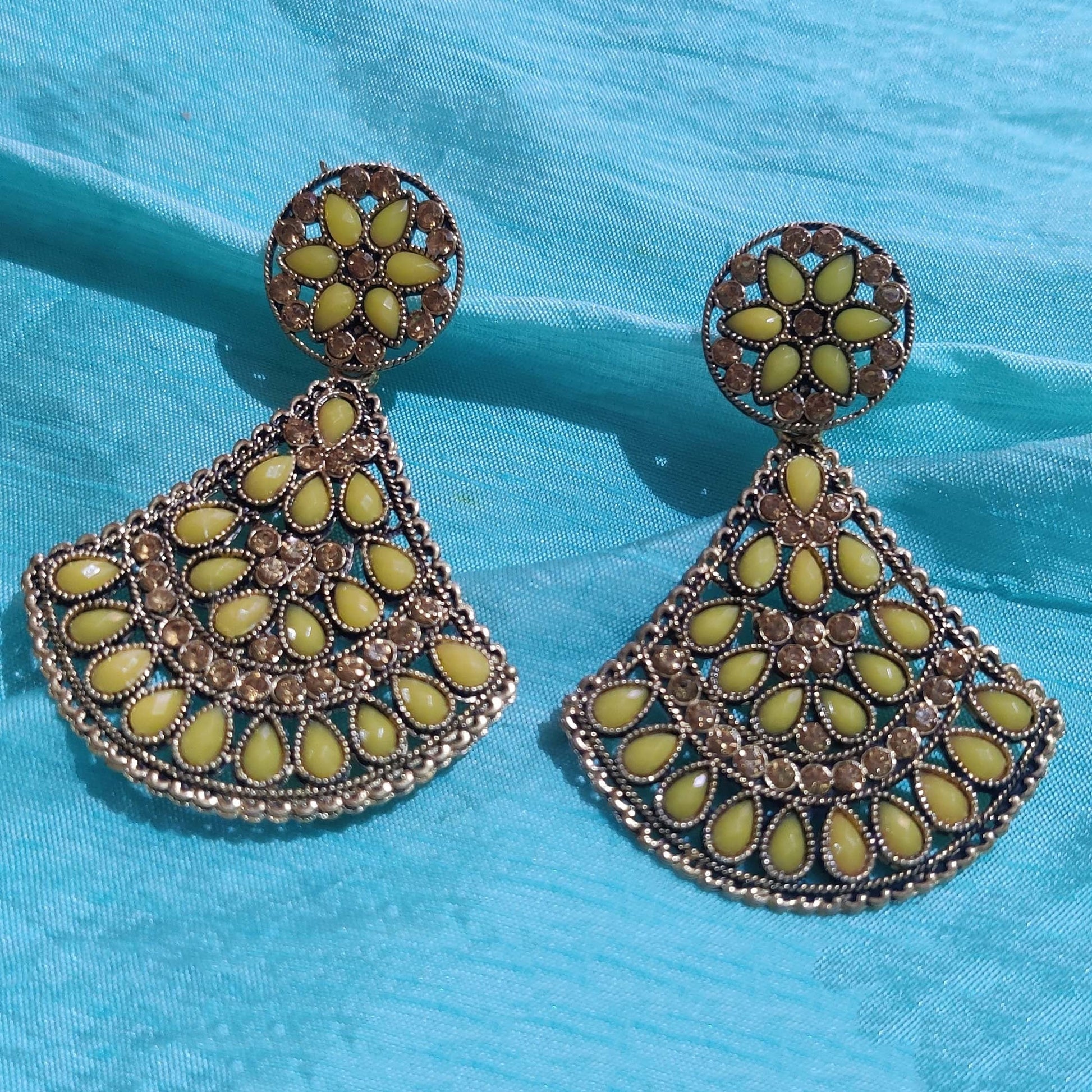 Vastradi Alloy Crystal Fan Stone Work Earring in Yellow Colour ER1200007